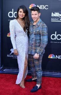 Priyanka Chopra (L) and Nick Jonas arrive for the 2019 Billboard Music Awards at the MGM Grand Garden Arena in Las Vegas, Nevada on May 1, 2019.  LAV20190501025 JIMxRUYMEN