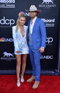 (L-R) Brian Kelley and Brittney Marie Cole Kelley arrive for the 2019 Billboard Music Awards at the MGM Grand Garden Arena in Las Vegas, Nevada on May 1, 2019.  LAV20190501092 JIMxRUYMEN