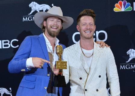 Brian Kelley (L) and Tyler Hubbard of Florida Georgia Line appear backstage after winning the award for Best Country Song for Meant to Be, during the 2019 Billboard Music Awards at the MGM Grand Garden Arena in Las Vegas, Nevada on May 1, 2019.  LAV20190501182 JIMxRUYMEN