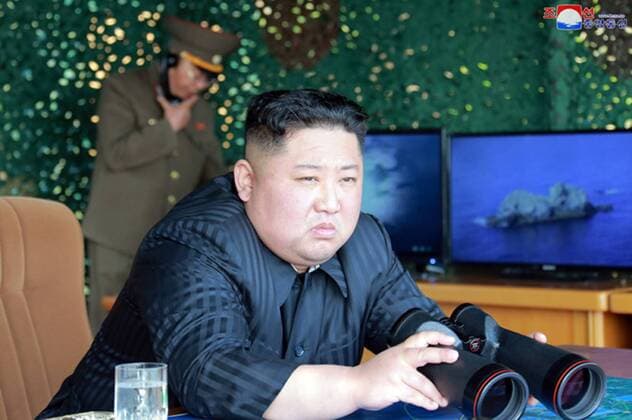 This image released on May 5, 2019, by the North Korean Official News Service (KCNA), shows North Korean leader Kim Jong Un supervising a military strike drill at an undisclosed location near the East Sea. According to KCNA, the purpose of the drill was to test the precision of large-caliber long-range multiple rocket launchers and tactical guided weapons.  WAX2019050501 KCNA