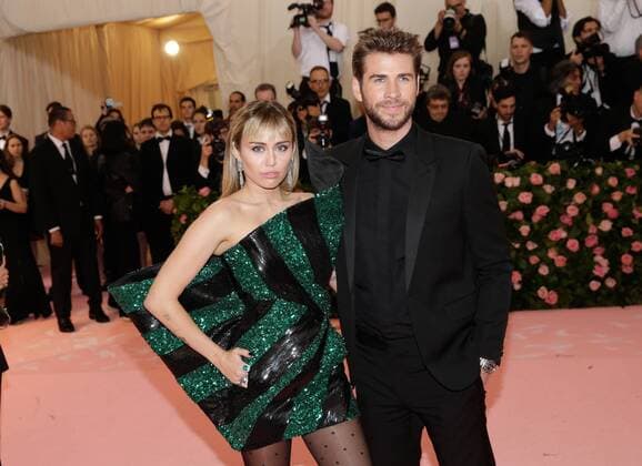 Miley Cyrus and Liam Hemsworth arrive on the red carpet at The Metropolitan Museum of Art s Costume Institute Benefit Camp: Notes on Fashion at Metropolitan Museum of Art in New York City on May 6, 2019.  NYP20190506310 JOHNxANGELILLO