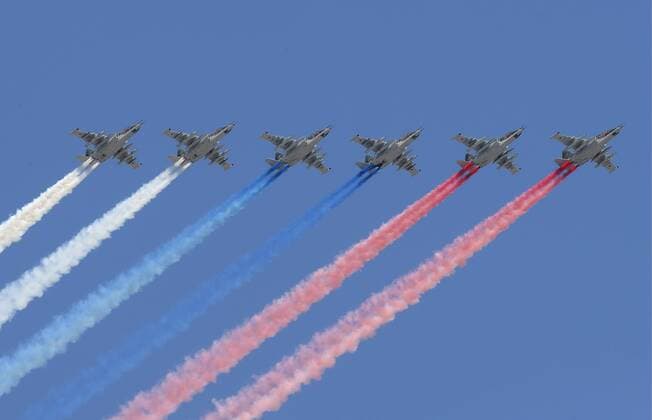 MOSCOW, RUSSIA â€“ MAY 7, 2019: Sukhoi Su-25 jets leave a trail in the Russian national colours as they fly in formation over Moscow during the dress rehearsal of a Victory Day air show marking the 74th anniversary of the victory over Nazi Germany in the 1941-1945 Great Patriotic War, the Eastern Front of World War II. Sergei Karpukhin TASS  TS0AA9F8