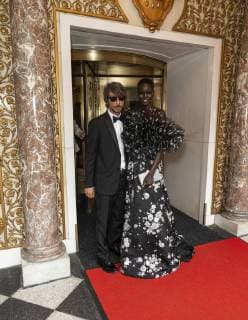 USA: Met Gala celebrities at The Pierre Hotel Pierpaolo Piccioli and Adut Akech wearing gown by Valentino leaves The Pierre Hotel for Met Gala on theme Camp: Notes on Fashion New York New York United States Lev Radin  LevxRadin