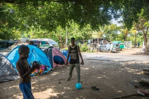 Children play outside in Tapachula, Mexico on May 8, 2019. Migrants from Africa and Haiti have temporarily settled near (INM) Instituto Nacional de Migración Delegación Federal en Chiapas while hoping to apply an exit visa so they can make their way to the US-Mexico border.  TP2019050807 ARIANAxDREHSLER