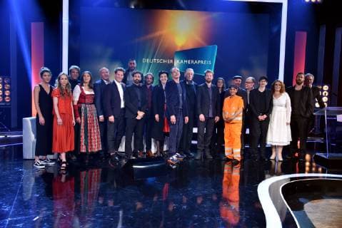 Group picture with all prizewinners and laudators 2019 on stage at the award ceremony of the 29th German Camera Prize Here, cameramen and editors are honoured for their outstanding performance