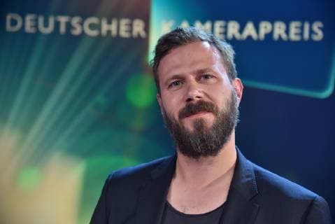 The cameraman Thomas Lutz Prize winner in the category Camera Documentation for Berlin is cleaning at the award ceremony of the 29th German Camera Prize Cameramen and editors are honoured for their outstanding performance here