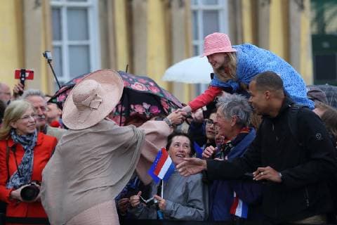 Queen Maxima of the Netherlands welcomes onlookers in front of Sanssouci Palace in Potsdam, 22 May 2019 Dutch royal couple visits Brandenburg