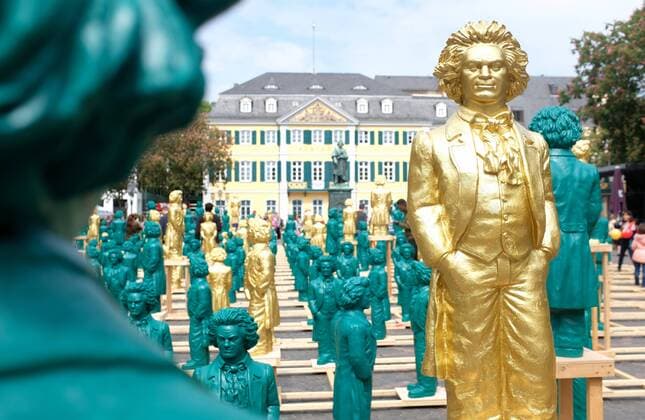 700 small Ludwig van Beethoven sculptures stand on the Münsterplatz in front of the Beethoven monument The statues were designed by conceptual artist Ottmar Hörl on the occasion of Ludwig van Beethovens 250th birthday 18 05 2019 in Bonn NOTE No model release available There is no written consent of the persons depicted for publication MR:N