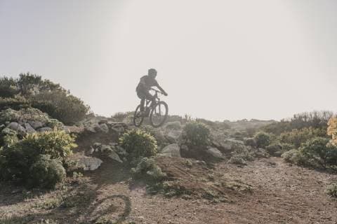 Spain, Lanzarote, mountainbiker on a trip in desertic landscape model released Symbolfoto  AHSF00086