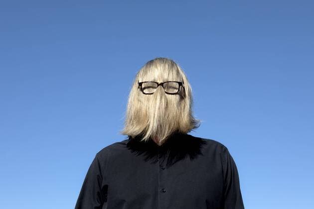 Blond hair covering man s face wearing glasses model released Symbolfoto  PSTF00367