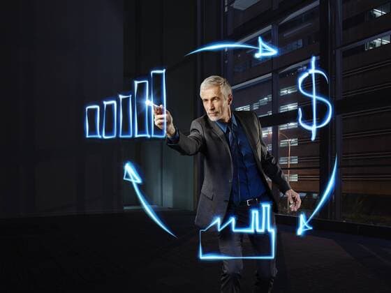 Businessman painting economic circulation with light model released Symbolfoto property released  RORF01802