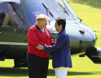 Trump in Japan U.S. President Donald Trump (L) is greeted by Japanese Prime Minister Shinzo Abe at Mobara Country Club in Chiba Prefecture on May 26, 2019, upon Trump s arrival aboard the Marine One helicopter. Abe and Trump were scheduled to play golf at the course near Tokyo -- their fifth round together since the U.S. leader took office in 2017. (Pool photo) 