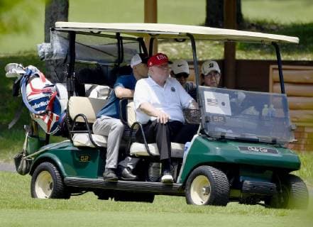 Trump in Japan U.S. President Donald Trump (front L) sits next to Japanese Prime Minister Shinzo Abe in a golf cart at Mobara Country Club in Chiba Prefecture, near Tokyo, on May 26, 2019. The two leaders played their fifth round of golf together since Trump took office in 2017. 