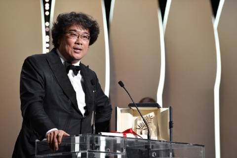 (190526) -- CANNES, May 26, 2019 -- Director Bong Joon-Ho receives the Palme d Or award for Parasite on stage during the closing ceremony of the 72nd Cannes Film Festival in Cannes, France, on May 25, 2019. The curtain of the 72nd edition of the Cannes Film Festival fell on Saturday evening, with South Korean movie Parasite winning this year s most prestigious award, the Palme d Or. ) FRANCE-CANNES-FILM FESTIVAL-AWARDS KimxYida 