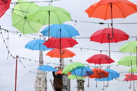 Coloured umbrellas at festival - Zagreb, Croatia 30.05.2019., Zagreb, Croatia - Hanging coroured umbrellas as a part of preparation for Bas Nas gourmet & music festival at upper town in Zagreb  PatrikxMacek PIXSELL