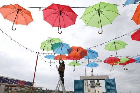 Coloured umbrellas at festival - Zagreb, Croatia 30.05.2019., Zagreb, Croatia - Hanging coroured umbrellas as a part of preparation for Bas Nas gourmet & music festival at upper town in Zagreb  PatrikxMacek PIXSELL