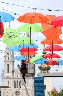 Coloured umbrellas at festival - Zagreb, Croatia 30.05.2019., Zagreb, Croatia - Hanging coroured umbrellas as a part of preparation for Bas Nas gourmet & music festival at upper town in Zagreb  PatrikxMacek PIXSELL