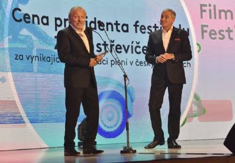 Czech singer Karel Gott, left, takes the Golden Slipper award for exceptional interpretation of songs in Czech films, within the 59th Zlin Film Festival - International film festival for children and youth, in Zlin, Czech republic, on May 31, 2019. On the right side is seen moderator Jan Censky. (CTKxPhoto DaliborxGluck) CTKPhotoP201905311089301  dg004A