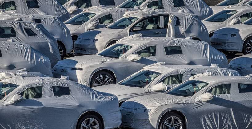 At Seaport Emden in Lower Saxony Germany, Volkswagen and Audi cars are ready for shipment overseas Volkswagen and Audi cars have protective covers and are waiting to be loaded on board Emden harbour has a so-called Autoport Audi and Volkswagen cars are ready for shipment overseas at the Emden seaport, Emden Lower Saxony Germany