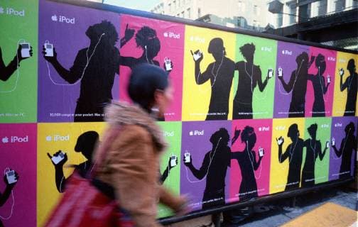 Apple to phase out iTunes app Posters for the wildly popular Apple Computers iPod cover a wall on October 19, 2003. Apple announced that it will be phasing the out the ancient (in computer years) from 1999 iTunes app and replacing it with three updated apps. (  RICHARDxB.xLEVINE