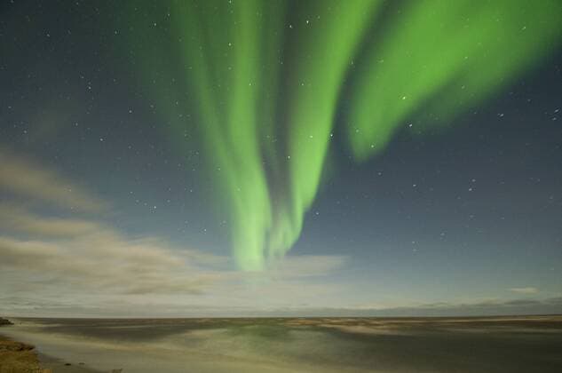 USA Northern lights, Aurora borealis, glow brightly and snake across the night sky, over the Beaufort Sea, off shore from the Arctic National Wildlife Refuge, Alaska, USA, September  1363439 StevenxKazlowski