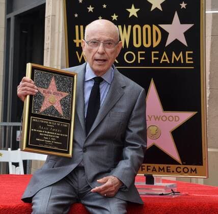 Actor Alan Arkin holds a replica plaque during a ceremony honoring him with the 2,665th star on the Hollywood Walk of Fame in Los Angeles on June 7, 2019.  LAP2019060709 JIMxRUYMEN
