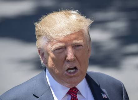 President Donald Trump responds to a reporter s question during an impromptu press conference on the South Lawn of the White House in Washington, DC on June 11, 2019. He then departed for Iowa.  WAS2019061106 PATxBENIC