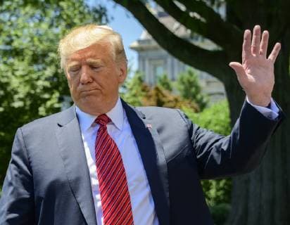 June 11, 2019 - Washington, District of Columbia, U.S. - United States President Donald J. Trump waves after taking questions from reporters as he prepares to depart the South Lawn of the White House in Washington, DC for a trip to Iowa. He will return this evening Washington U.S. - ZUMAs152 20190611_zaa_s152_042 Copyright: xRonxSachsx