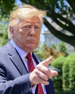June 11, 2019 - Washington, District of Columbia, U.S. - United States President Donald J. Trump takes questions from reporters as he prepares to depart the South Lawn of the White House in Washington, DC for a trip to Iowa. He will return this evening Washington U.S. - ZUMAs152 20190611_zaa_s152_043 Copyright: xRonxSachsx