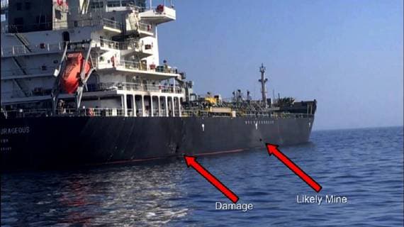 In this Powerpoint slide provided by U.S. Central Command damage from an explosion, left, and a likely limpet mine can be seen on the hull of the civilian vessel M V Kokuka Courageous in the Gulf of Oman, June 13, 2019, as the guided-missile destroyer USS Bainbridge (DDG 96), not pictured, approaches the damaged ship. Sailors aboard Bainbridge aided the crew of Kokuka Courageous.  WAX2019061409 U.S.xNAVY