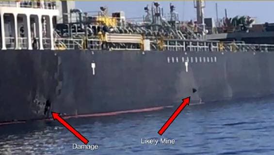 In this Powerpoint slide provided by U.S. Central Command damage from an explosion, left, and a likely limpet mine can be seen on the hull of the civilian vessel M V Kokuka Courageous in the Gulf of Oman, June 13, 2019, as the guided-missile destroyer USS Bainbridge (DDG 96), not pictured, approaches the damaged ship. Sailors aboard Bainbridge aided the crew of Kokuka Courageous.  WAX2019061418 U.S.xNAVY