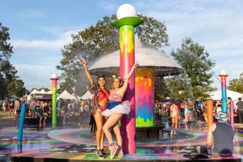 June 14, 2019 - Manchester, Tennessee, U.S - Two girls pose at the fountain during the Bonnaroo Music + Arts Festival in Manchester, Tennessee Manchester U.S. - ZUMAs135 20190614_zap_s135_085 Copyright: xDanielxDeSloverx