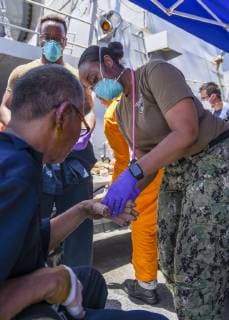 June 13, 2019 - Gulf Of Oman - Sailors aboard the Arleigh Burke-class guided-missile destroyer USS Bainbridge (DDG 96) render aid to the crew of the M V Kokuka Courageous. Bainbridge is deployed to the U.S. 5th Fleet areas of operations in support of naval operations to ensure maritime stability and security in the Central Region, connecting the Mediterranean and Pacific through the western Indian Ocean and three strategic choke points. Gulf Of Oman - ZUMAz03_ 20190613_sha_z03_278 Copyright: xUSxNavyx