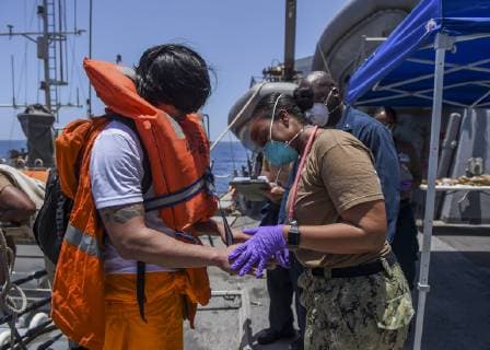 June 13, 2019 - Gulf Of Oman - Sailors aboard the Arleigh Burke-class guided-missile destroyer USS Bainbridge (DDG 96) render aid to the crew of the M V Kokuka Courageous. Bainbridge is deployed to the U.S. 5th Fleet areas of operations in support of naval operations to ensure maritime stability and security in the Central Region, connecting the Mediterranean and Pacific through the western Indian Ocean and three strategic choke points. Gulf Of Oman - ZUMAz03_ 20190613_sha_z03_280 Copyright: xUSxNavyx