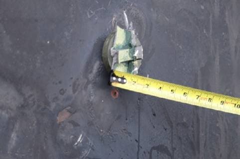 June 13, 2019 - Gilf of Oman - The aluminum and green composite material left behind following removal of an unexploded limpet mine used in an attack on the starboard side of motor vessel M T Kokuka Courageous, while operating in the Gulf of Oman, June 13, 2019. Gilf of Oman - ZUMAz03_ 20190613_sha_z03_285 Copyright: xDoDx