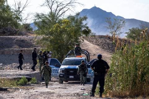 June 18, 2019 - Military personnel from the EjÅ½rcito Mexicano, Mexico s army, detain two migrants that were attempting to cross the Rio Grande into the United States through El Paso, Texas, in Ciudad Ju¡rez, Chihuahua, MÅ½xico. According to the Mexican military personnel, they began patrolling the border in Ciudad Ju¡rez on June 16 with intentions to prevent illegal immigration into the United States. - ZUMAj106 20190618_zap_j106_013 Copyright: xJoelxAngelxJuarezx