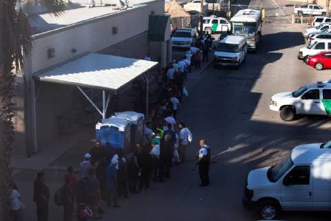 June 18, 2019 - Migrants wait in line to be released from an immigration holding facility nearby the Sante Fe Bridge in El Paso, Texas. The migrants were sent back to Ciudad Ju¡rez to wait as they battle their court cases as part of the Trump administration s Migrant Persecution Protocols (MPP) program. - ZUMAj106 20190618_zap_j106_019 Copyright: xJoelxAngelxJuarezx