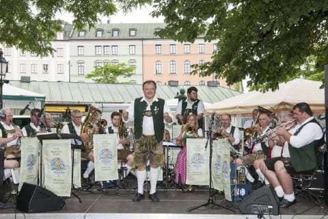 Munich, brass music festival in the beer garden on the Viktualienmarkt with the Oktoberfest musicians by Wolfgang Gruenbauer