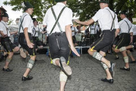 Muenchen, festival of brass music in the beer garden on the Viktualienmarkt with the traditional costume group of the Chiemgau Alpine Association