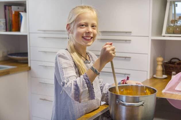 Portrait of happy girl cooking jam at home model released Symbolfoto property released  HSIF00523