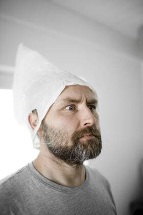 Portrait of angry man with plastic bag on his head model released Symbolfoto  KMKF00935