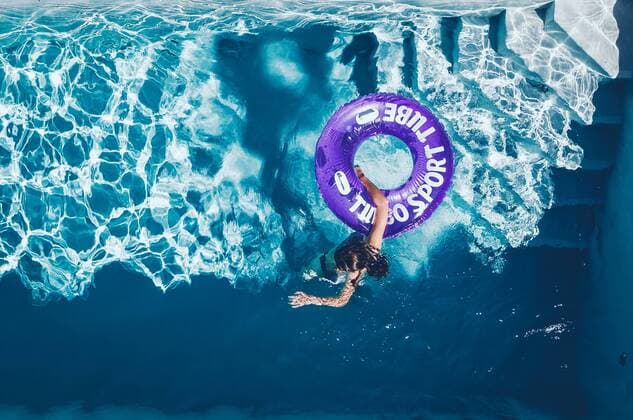 Kaprun THEME IMAGE a teen on a swimming tire in the swimming pool on a hot summer day, taken on 25 June 2019 in Kaprun, Austria a teenager on a swimming tire in the swimming pool on a hot summer day, Kaprun, Austria on 2019 06 25  EX_FEI