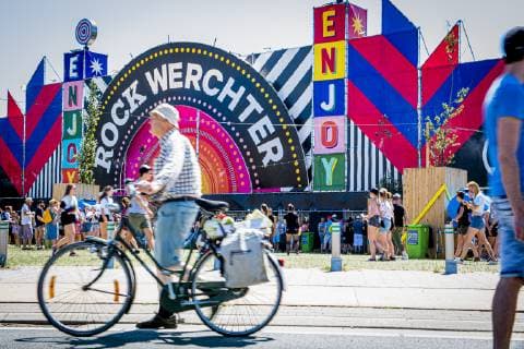 A man with his bike passes the entrance to the festival grounds, on the first day of the Rock Werchter music festival in Werchter, Thursday 27 June 2019. The 45th edition of the festival is taking place from 27 to 30 June.  JASPERxJACOBS 05614207