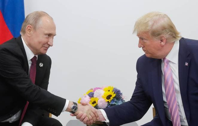 OSAKA, JAPAN - JUNE 28, 2019: Russia s President Vladimir Putin (L) and US President Donald Trump shake hands during a meeting on the sidelines of the 2019 G20 Summit at the INTEX Osaka International Exhibition Centre. Mikhail Metzel TASS  TS0B1452