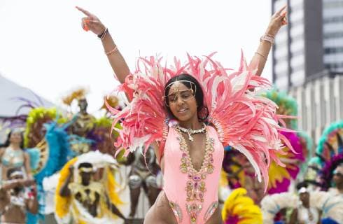 (190709) -- TORONTO, July 9, 2019 -- A dressed-up reveler performs during the official launch ceremony of the 2019 Toronto Caribbean Carnival in Toronto, Canada, July 9, 2019. The annual four-week cultural festival of Caribbean music, cuisine and revelry kicked off on Tuesday. King and Queen costume competition, Junior Carnival, Grand Parade and other events will be held during the festival. ) CANADA-TORONTO-CARIBBEAN CARNIVAL-LAUNCH CEREMONY ZouxZheng 