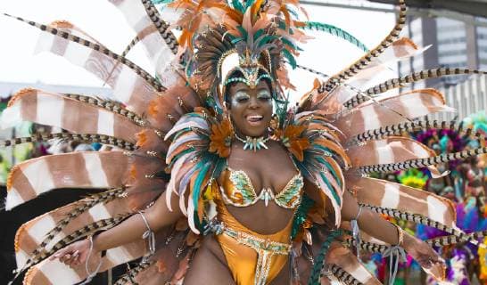 (190709) -- TORONTO, July 9, 2019 -- A dressed-up reveler performs during the official launch ceremony of the 2019 Toronto Caribbean Carnival in Toronto, Canada, July 9, 2019. The annual four-week cultural festival of Caribbean music, cuisine and revelry kicked off on Tuesday. King and Queen costume competition, Junior Carnival, Grand Parade and other events will be held during the festival. ) CANADA-TORONTO-CARIBBEAN CARNIVAL-LAUNCH CEREMONY ZouxZheng 