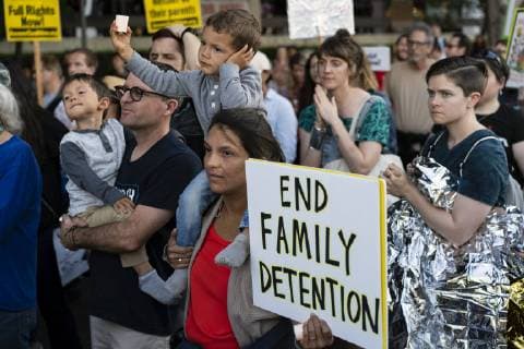March 15, 2019 - Los Angeles, California, United States - A child holds a candle during a protest against ICE raids and migrant detention camps outside an Immigration and Customs Enforcement detention center in Los Angeles. Organizers called on the Trump administration to close all migrant detention camps. Similar Lights for Liberty rallies and vigils took place across the nation. Los Angeles United States - ZUMAs197 20190315_zaa_s197_608 Copyright: xRonenxTivonyx