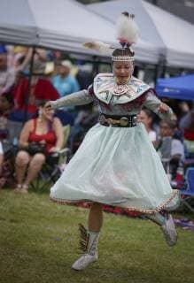(190715) -- VANCOUVER, July 15, 2019 (Xinhua) -- A dancer performs during the 32nd annual Squamish Nation Youth Pow Wow at Capilano Reserve Park in west Vancouver, Canada, July 14, 2019. First Nations people from Canada and the U.S. took part in the 32nd annual Squamish Nation Youth Pow Wow in celebration of indigenous cultures. Pow Wow is an indigenous cultural activity in which people socialize together via different activities like dancing, singing, and honouring the traditions of their ancestors. (Xinhua Liang Sen) CANADA-VANCOUVER-SQUAMISH NATION YOUTH POW WOW 