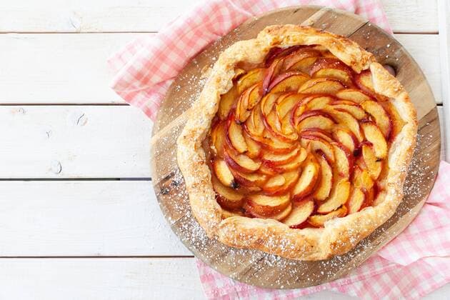 Homemade peach pie with icing sugar Homemade peach pies Homemade peach pie with icing sugar Homemade peach pies Homemade peach pie with puff pastry and icing sugar  1079705766