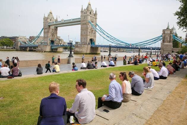July 17, 2019 - London, United Kingdom - City workers and tourists gathered at Moor near the Tower Bridge during a warm and sunny day in London..The hot weather continues in the UK, according to the Meteorological station, rain is forecast across the country during the next few days. London United Kingdom - ZUMAs197 20190717_zab_s197_080 Copyright: xDinendraxHariax